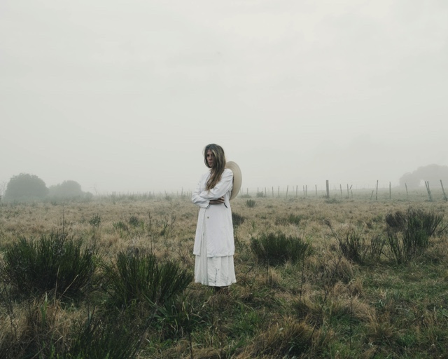 Fine art photographer Heidi Lender poses in this self-portrait in a field near her home in Garzon, Urugay